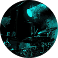 A man playing drums in a blue circle.