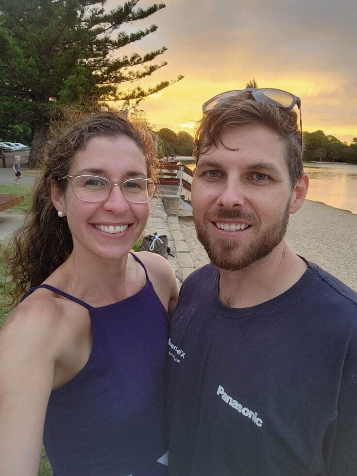 Isaac Jamieson and wife strike a pose for a sunset selfie at the lake.