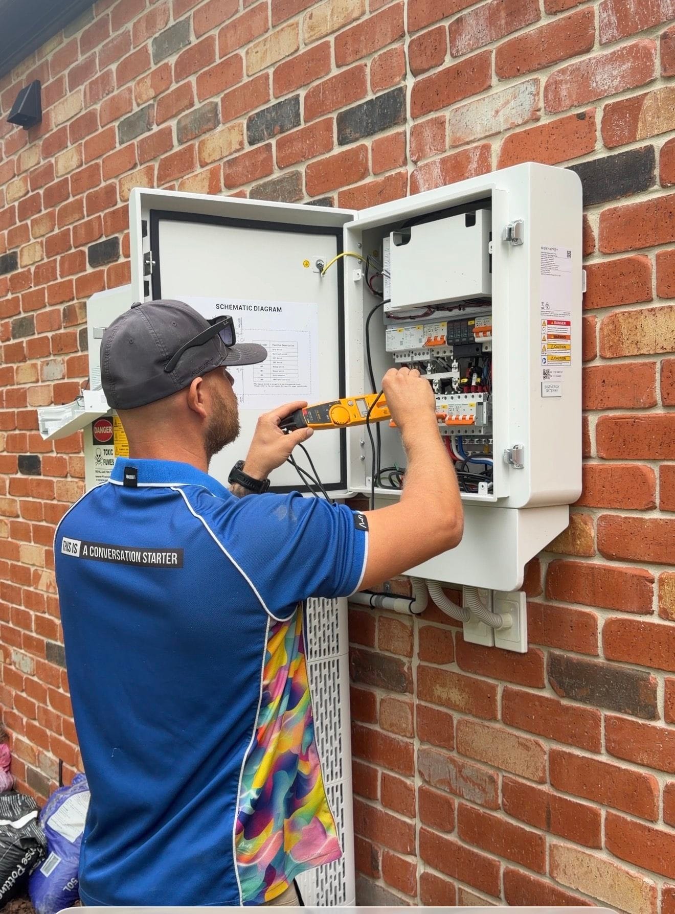 Tenmen Electrical technician performing electrical testing and commissioning work on a switchboard installation at a home in Caloundra on the Sunshine Coast.