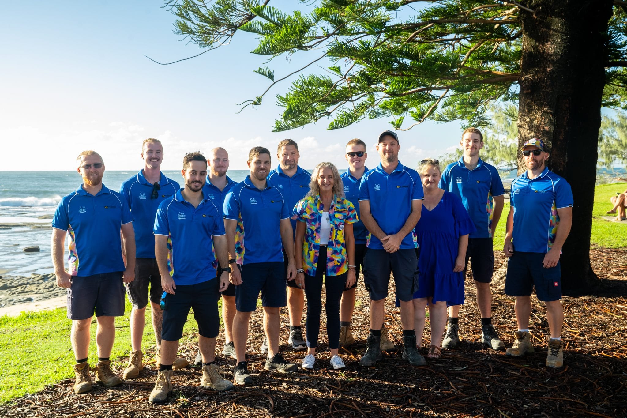 The Tenmen Electrical team standing on the Sunshine Coast foreshore. Local electricians providing solar, air conditioning and electrical services across the Sunshine Coast.