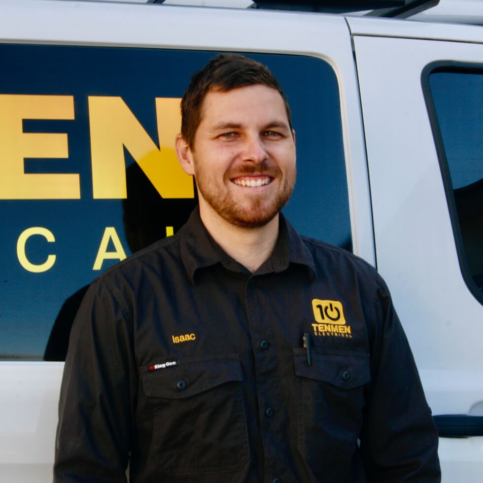 The Tenmen Electrical director standing in front of the company van.