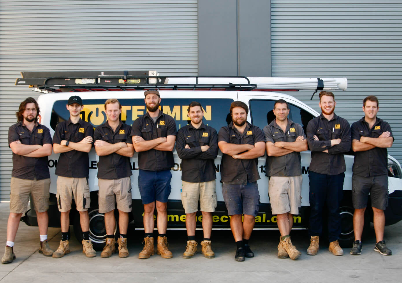 The Tenmen Electrical team of solar installers standing in front of the company van on the Sunshine Coast.