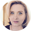 An image of a woman with blond hair and blue eyes.