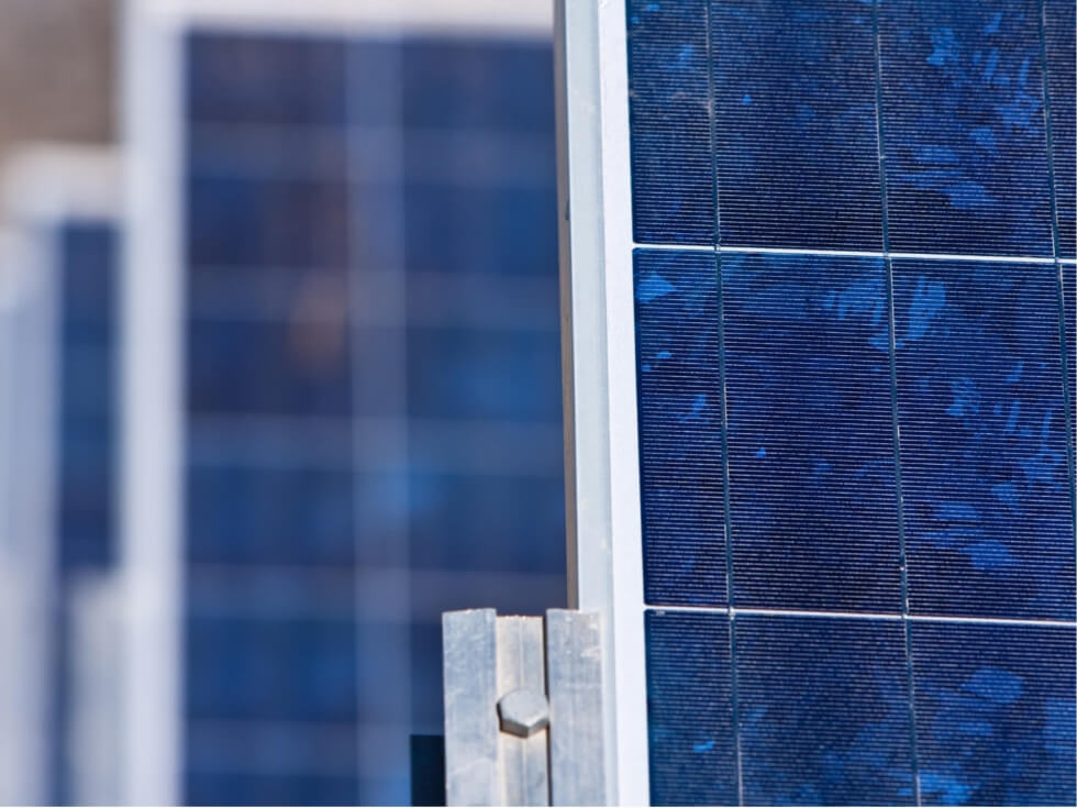 A close up of a row of solar panels.