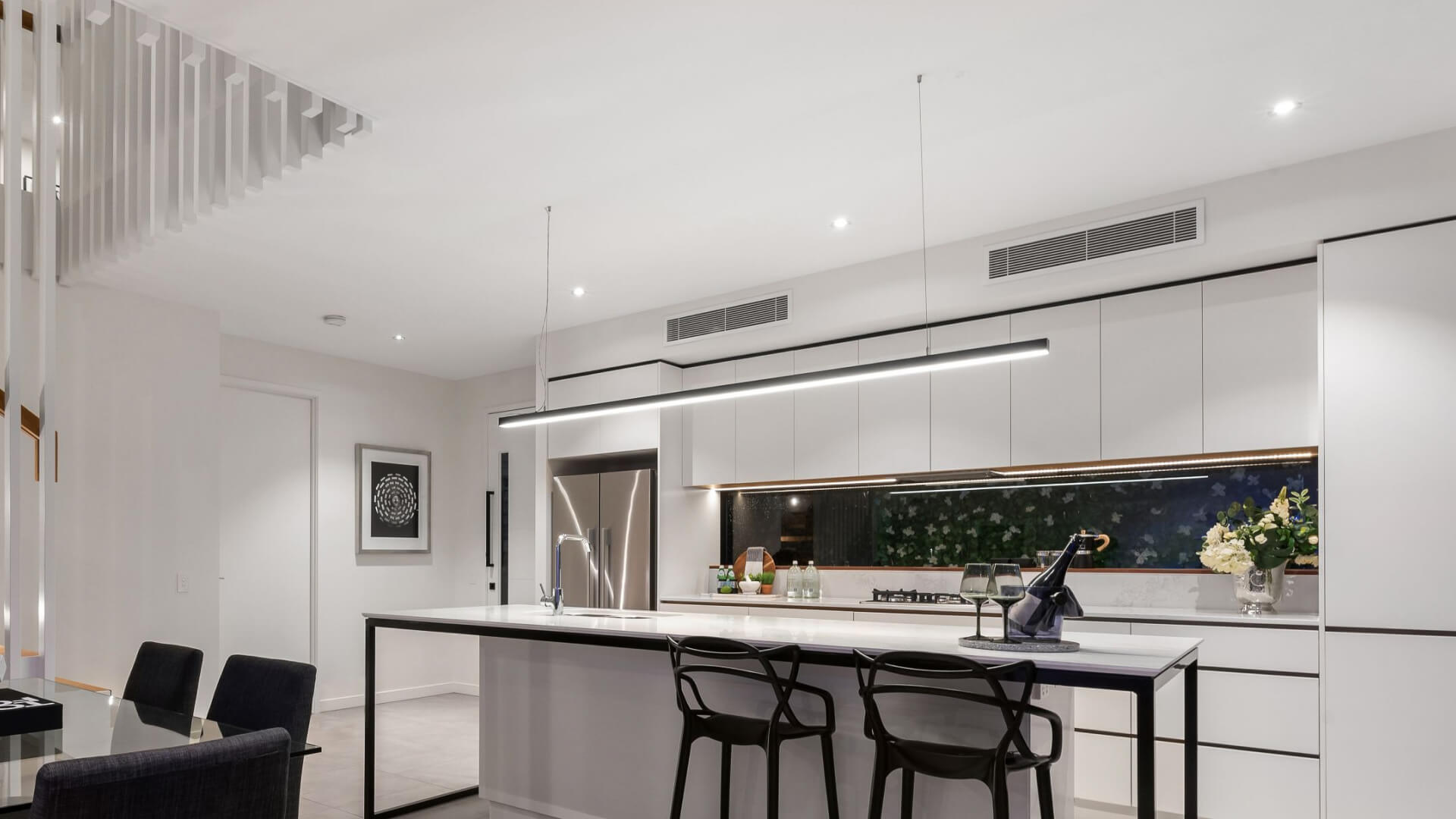 A modern kitchen on the Sunshine Coast with ducted air conditioner.