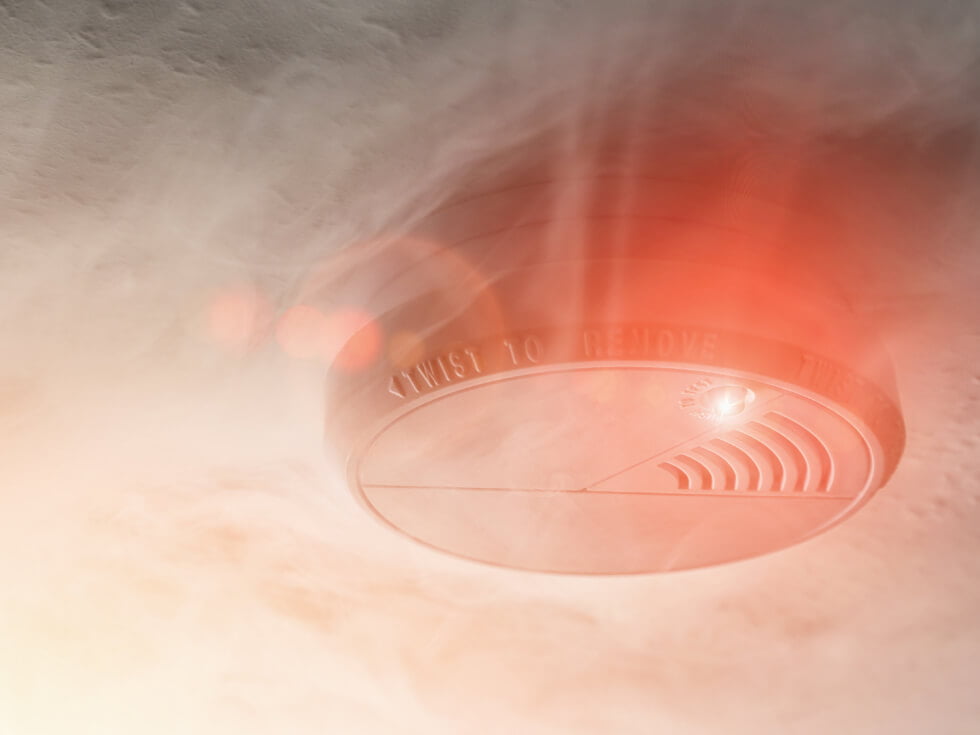 An image of a smoke detector in the air.